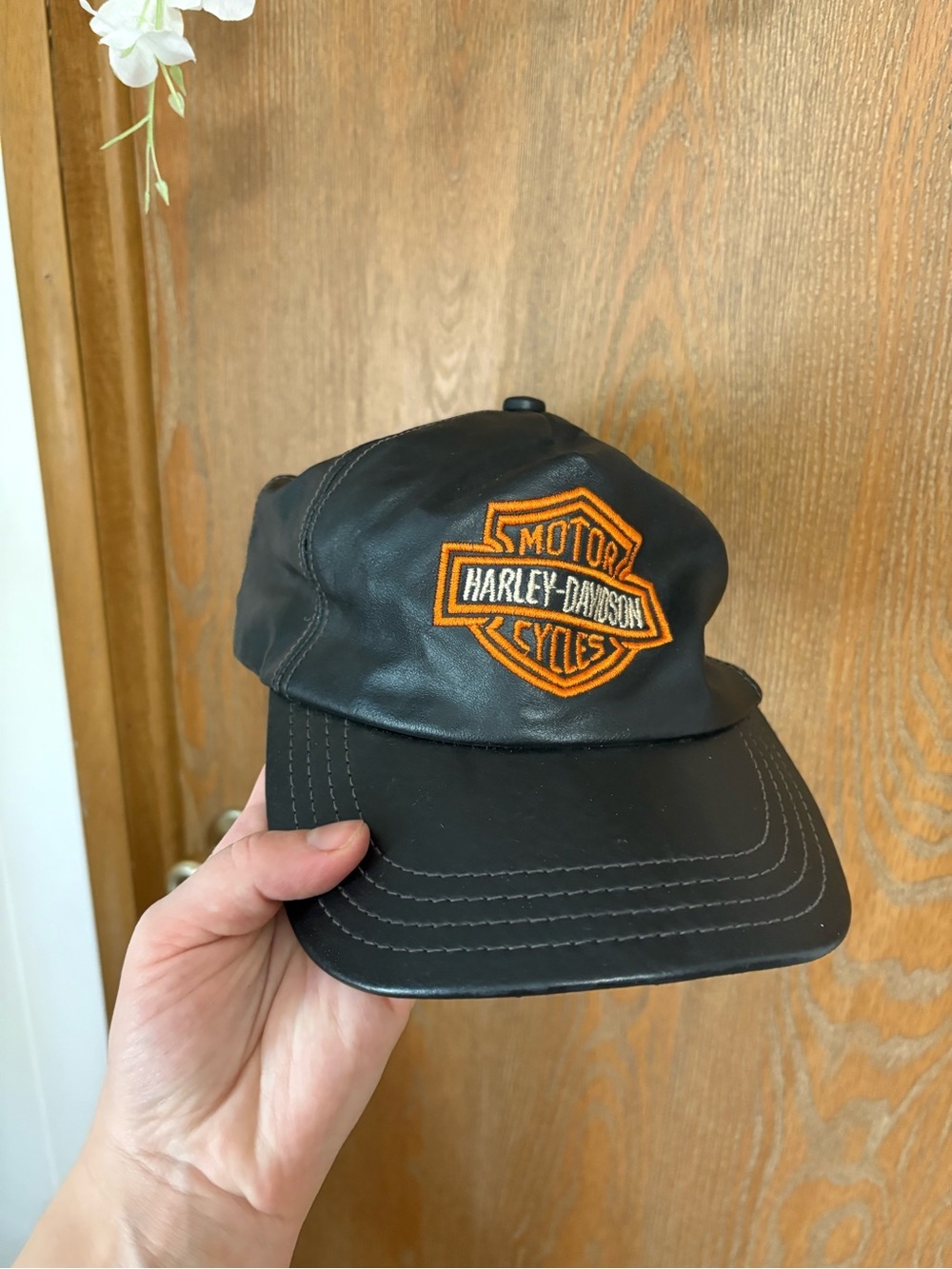 Harley-Davidson Black Leather Cap with Orange Logo Patch
